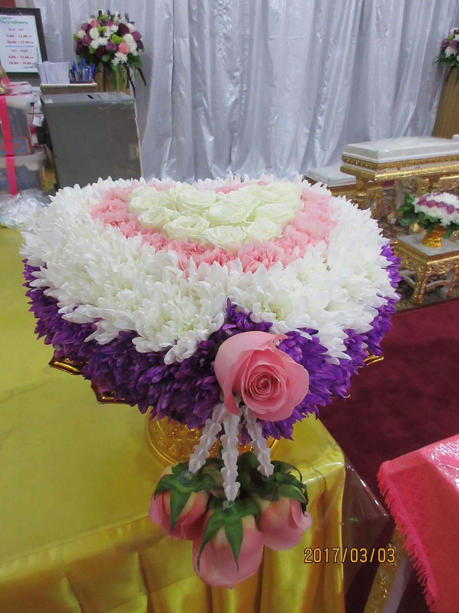 Couple receiving monk blessing