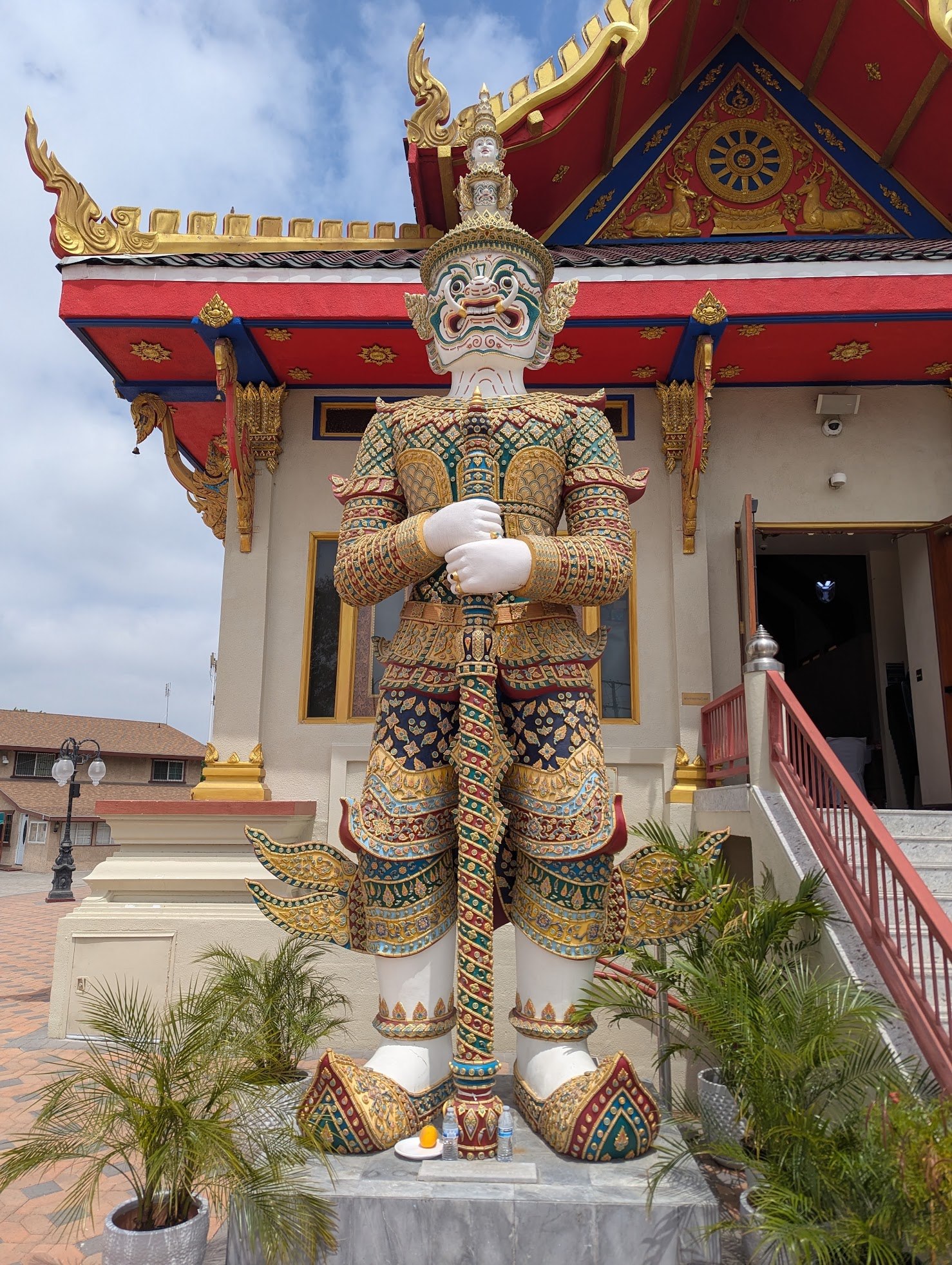 The white Sahasadecha guardian statue at the entrance of Wat Thai of Los Angeles